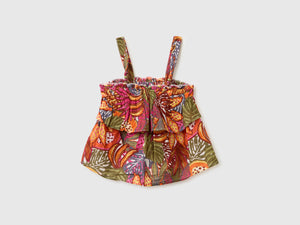 Top with ruffles and beads