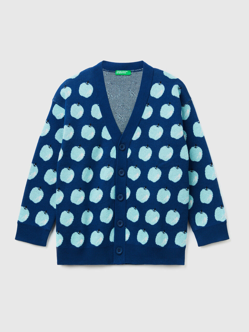 Blue cardigan with apple pattern
